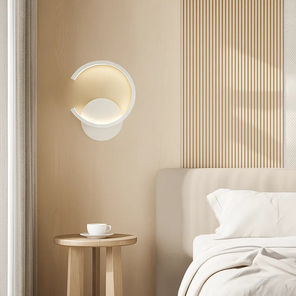 Applique murale dorée LED circulaire en métal style moderne pour chambre