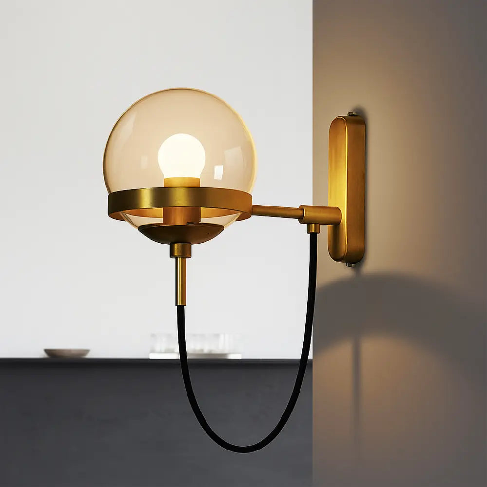 Applique murale dorée forme globe design vintage moderne en verre et métal