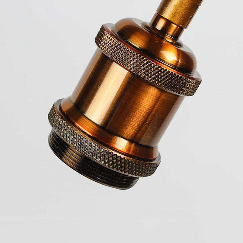 Applique murale industrielle style Edison en laiton ajustable, ampoule visible pour éclairage ciblé et décoratif.